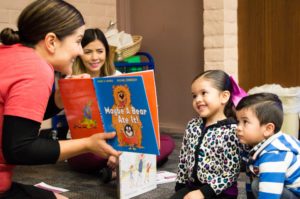 Volunteer reading to children